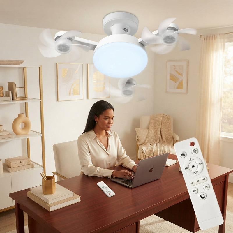 A professional working at a desk in a modern home office with a sleek ceiling fan light mounted overhead.