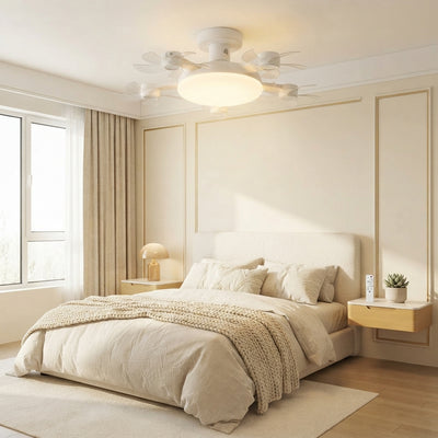 A modern, silent LED ceiling fan with integrated lighting installed in a bright, minimalist bedroom with warm cream and golde